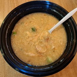 Arroz Caldo, a Filipino weekend special of savory rice porridge with pork. I already stirred it up and ate some. No egg was in it.