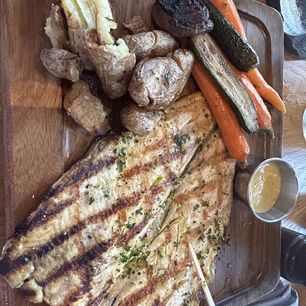 Bigfire - Trout with a creamy lime garlic sauce fresh vegetables and crispy potatoes - American Near Me - Orlando, Florida Bigfire - Trout with a creamy lime garlic sauce fresh vegetables and crispy potatoes - American Near Me - Orlando, Florida