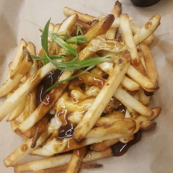 Elite Brewing & Cidery - Poutine with "green onion" which was a garnish not part of the dish as advertised. - Cideries Near Me - Calgary, Alberta Elite Brewing & Cidery - Poutine with "green onion" which was a garnish not part of the dish as advertised. - Cideries Near Me - Calgary, Alberta