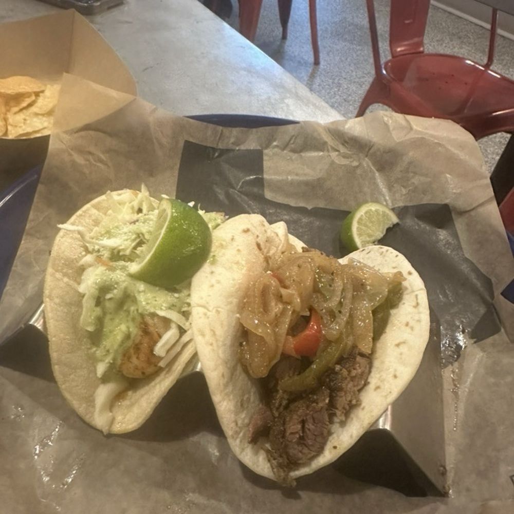 Blackened shrimp in a corn tortilla and beef fajita in a flour tortilla. Blackened shrimp in a corn tortilla and beef fajita in a flour tortilla.