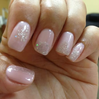 Exotic Nails - Two-tone geometric design with a different shape on each nail highlighted with glitter - Nail Salons Near Me - West Covina, California Exotic Nails - Two-tone geometric design with a different shape on each nail highlighted with glitter - Nail Salons Near Me - West Covina, California
