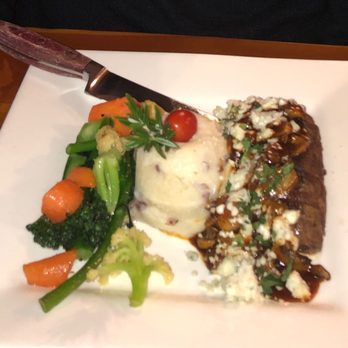 Izaak Walton Restaurant - Steak with mushrooms and blue cheese; mashed potatoes, fresh vegetables. - Hotels Near Me - Essex, Montana