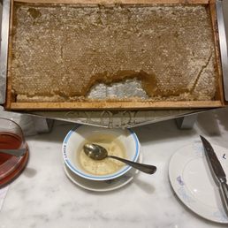 Fresh honey dripping from actual honeycomb. Impressive. Fresh honey dripping from actual honeycomb. Impressive.