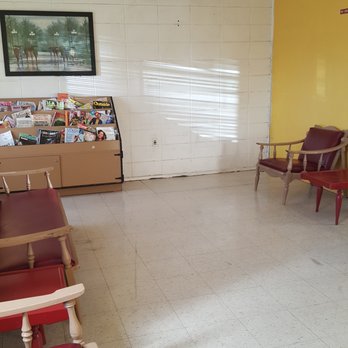 Dean's Village Laundromat - Sitting area has some chairs, a couch, and reading materals - Laundromat Near Me - Tucson, Arizona