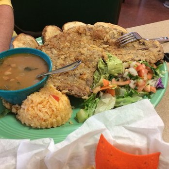 Las Carretas - Veal Milanese with charra beans, papas and rice! Huge! - Mexican Near Me - San Antonio, Texas