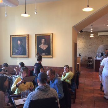 Spacca Napoli - The view from section 2 towards section 1. The paintings really make a positive difference in the room design. Oct 2016. - Pizza Near Me - Chicago, Illinois