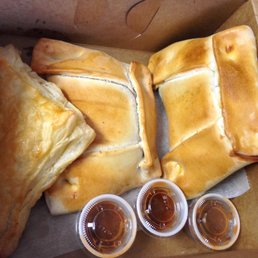 Empanadas de Queso and Empanadas de Carne (x2) with hot sauce on the side Empanadas de Queso and Empanadas de Carne (x2) with hot sauce on the side