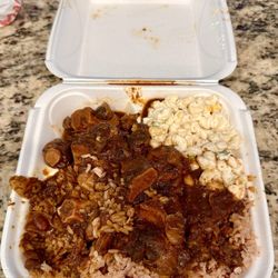 UpTop Jamaican Restaurant & Lounge - Oxtail with rice and peas, and a macaroni salad.