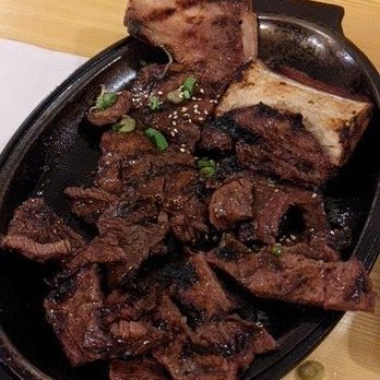 Korean Village Restaurant - It was two strips but I started cutting already lol - Korean Near Me - Toronto, Ontario