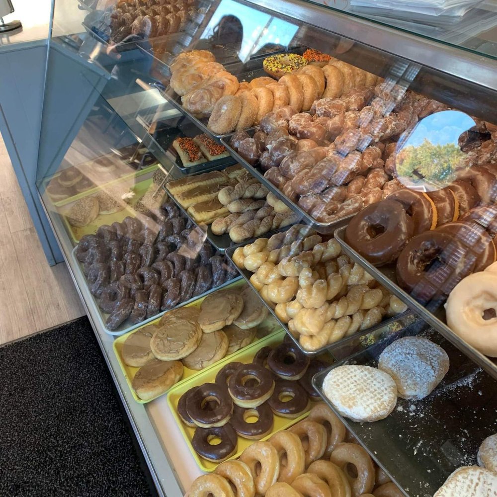 Sweet Shop - One of the display cases filled with donuts,  they smell wonderful. - Bakeries Near Me - Greenfield, Indiana