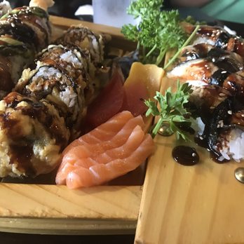 Sushi World - Part of our first order.  Unagi, salmon sashimi, and some tasty rolls. - Japanese Near Me - Chicago, Illinois