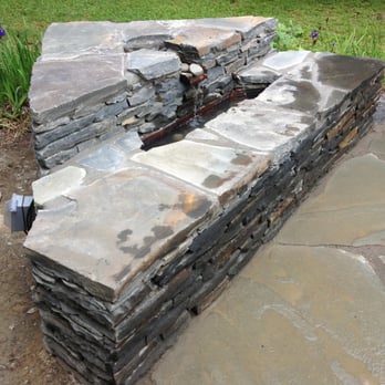 Toolbox Construction - This water feature is fully equip with custom copper flashing to enhance the flowing water appearance and electrical power fo... - General Contractors Near Me