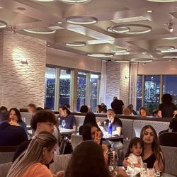 HAVEN Riverfront Restaurant & Bar - Main dining room with NYC view at dusk