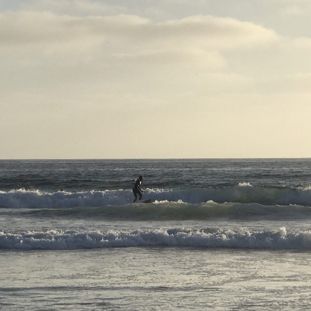A dude surfing A dude surfing
