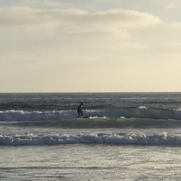 A dude surfing A dude surfing