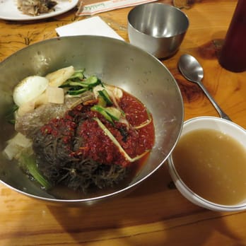 Seoul Tofu House - Bibim naeng myun - arrowroot noodles with icy cold broth. Served with egg, cucumber, radish, beef, and spicy red sauce. - Korean Near Me - Duluth, Georgia Seoul Tofu House - Bibim naeng myun - arrowroot noodles with icy cold broth. Served with egg, cucumber, radish, beef, and spicy red sauce. - Korean Near Me - Duluth, Georgia