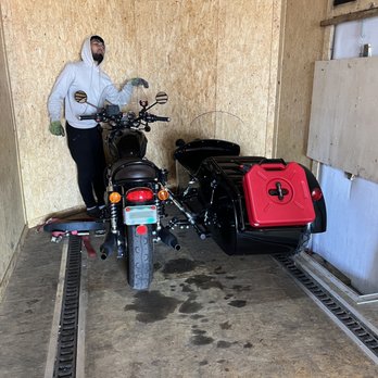 Hyper Ship - Carefully loading the motorcycle with attached sidecar into enclosed trailer. - Movers Near Me Hyper Ship - Carefully loading the motorcycle with attached sidecar into enclosed trailer. - Movers Near Me