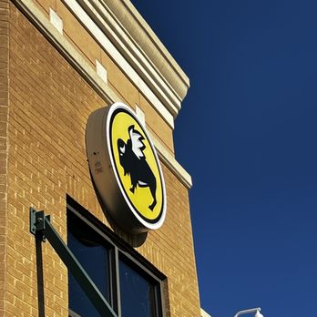 Buffalo Wild Wings - the logo on the side of a building - Chicken Wings Near Me - High Point, North Carolina Buffalo Wild Wings - the logo on the side of a building - Chicken Wings Near Me - High Point, North Carolina