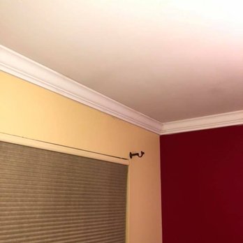 Mette's In & Out Construction - a room with red walls and a white ceiling - Painters Near Me Mette's In & Out Construction - a room with red walls and a white ceiling - Painters Near Me