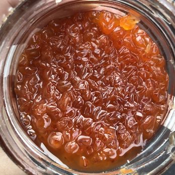 Golden Grain - a hand holding a jar of jam - Imported Food Near Me - Houston, Texas Golden Grain - a hand holding a jar of jam - Imported Food Near Me - Houston, Texas