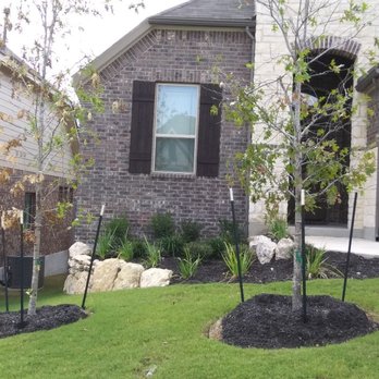 Texas Outdoor Living - a tree planted in front of a house - Masonry/Concrete Near Me Texas Outdoor Living - a tree planted in front of a house - Masonry/Concrete Near Me