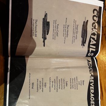 Blue Ocean - a menu for cocktails on a wooden table - Cocktail Bars Near Me - St. Louis, Missouri