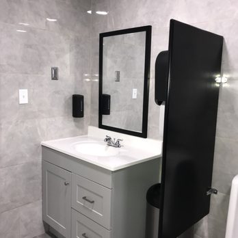 Fuel Stop - a bathroom with a sink, mirror, and towel dispenser - Convenience Stores Near Me - Port Lavaca, Texas Fuel Stop - a bathroom with a sink, mirror, and towel dispenser - Convenience Stores Near Me - Port Lavaca, Texas
