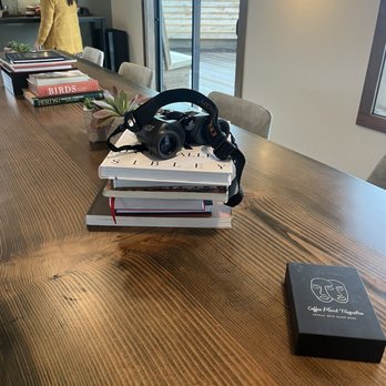 Confluence Cafe - a table with books and headphones on it - Cafes Near Me - Lyle, Washington Confluence Cafe - a table with books and headphones on it - Cafes Near Me - Lyle, Washington