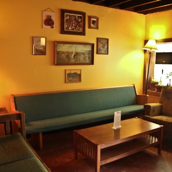 The Waypost - a living room with a couch and a coffee table - Music Venues Near Me - Portland, Oregon The Waypost - a living room with a couch and a coffee table - Music Venues Near Me - Portland, Oregon