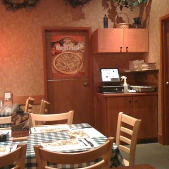 Pizza Delight - a dining area with a table and chairs - Pizza Near Me - Penetanguishene, Ontario Pizza Delight - a dining area with a table and chairs - Pizza Near Me - Penetanguishene, Ontario
