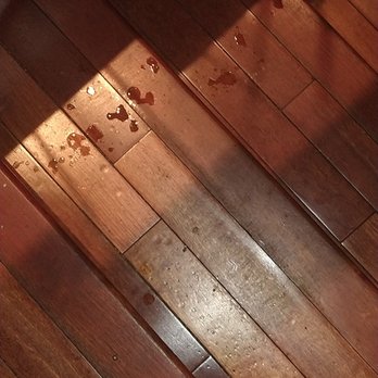 Lola's A Neighborhood Bar - Liquid spilled on steps wooden steps that is because the bar is down there - American Near Me - Washington, DC, District of Columbia