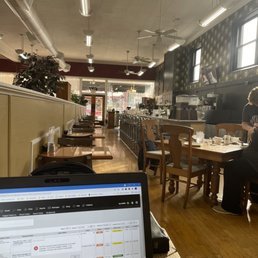 Partial view of dining area and counter seating.