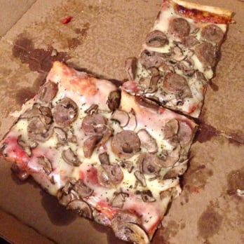 Leone's Sub & Pizza - Half-eaten half sheet with sausage and mushroom! - Sandwiches Near Me - Somerville, Massachusetts