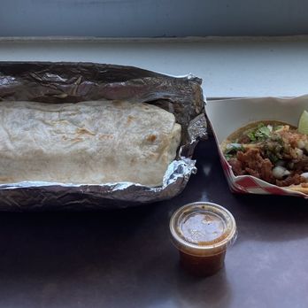 Pupuseria Jennifer - Burrrito Al Pastor; Taco Al Pastor; Red Sauce; and Jarritos Pineapple flavor before sauces were added - Food Trucks Near Me Pupuseria Jennifer - Burrrito Al Pastor; Taco Al Pastor; Red Sauce; and Jarritos Pineapple flavor before sauces were added - Food Trucks Near Me