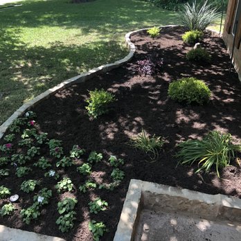 Duncan Tree & Landscape - Flower beds - Garage Door Services Near Me