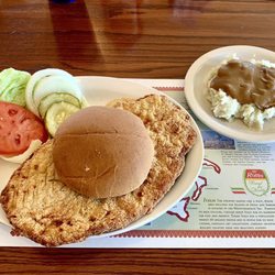Halftime Restaurant Pizza & Cocktails - Breaded, pork tenderloin sandwich with mashed potatoes and gravy...