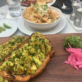 RH Rooftop Restaurant at RH Dallas - Avocado Toast. This is the best thing on the menu. A MUST ORDER. The avocado is amazing and drizzled in a delicious sauce. It's perfect. - American Near Me - Dallas, Texas RH Rooftop Restaurant at RH Dallas - Avocado Toast. This is the best thing on the menu. A MUST ORDER. The avocado is amazing and drizzled in a delicious sauce. It's perfect. - American Near Me - Dallas, Texas
