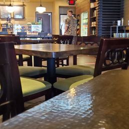 a cup of coffee on a table in a coffee shop