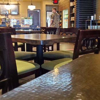 Starbucks - a cup of coffee on a table in a coffee shop - Coffee & Tea Near Me - Oceanside, California