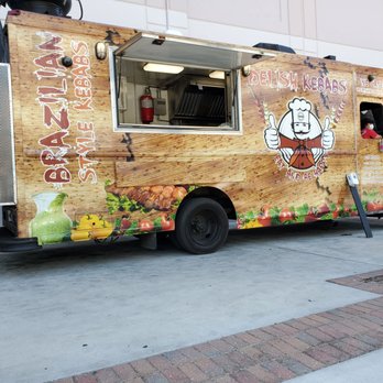 Delish Kebabs - a food truck parked on a sidewalk - Food Trucks Near Me Delish Kebabs - a food truck parked on a sidewalk - Food Trucks Near Me