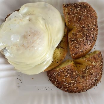 Ruby’s Bagels - Sausage egg and cheese with an over easy egg on an egg everything bagel - Bagels Near Me - Summerville, South Carolina Ruby’s Bagels - Sausage egg and cheese with an over easy egg on an egg everything bagel - Bagels Near Me - Summerville, South Carolina
