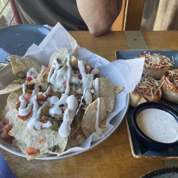 Kona Brewing - New nachos and old standby Happy Hour pepperoni rolls - Pubs Near Me - Honolulu, Hawaii