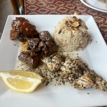 Khalil's II - Lamb kebab, chicken kebab, and kefta kebab with butter rice pilaf topped with toasted almonds and pine nuts - Syrian Near Me - Pittsburgh, Pennsylvania Khalil's II - Lamb kebab, chicken kebab, and kefta kebab with butter rice pilaf topped with toasted almonds and pine nuts - Syrian Near Me - Pittsburgh, Pennsylvania