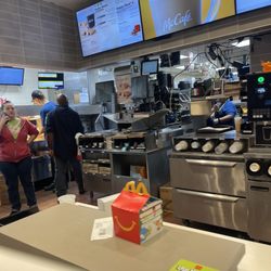 McDonald's - Two people standing around and one on her phone that also couldn't help ring my man out.