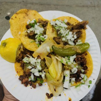 Tacos Arandinos - a person holding a plate of tacos - Food Trucks Near Me - Los Angeles, California Tacos Arandinos - a person holding a plate of tacos - Food Trucks Near Me - Los Angeles, California