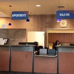 Kaweah Health Imaging & Breast Center - Front desk reception desk with the header signs.