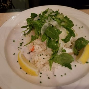 Surf Seafood - Haddock atop coconut jasmine rice with a arugala salad - Seafood Near Me - Nashua, New Hampshire