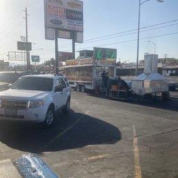 a truck and trailer in a parking lot