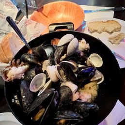 Seafood saute in white sauce. Bread included.