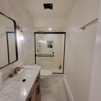 Power Home Contractors - a bathroom with marble counter tops - General Contractors Near Me Power Home Contractors - a bathroom with marble counter tops - General Contractors Near Me